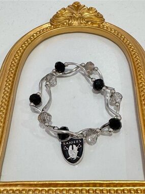 New Silver-Tone Stretchy Beaded Raiders Bracelet in Black and Clear